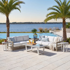 La Jolla Grand Lux 5-piece patio set styled on a poolside coastal patio - two teak sofas, stone-top coffee table and two end tables — view 1