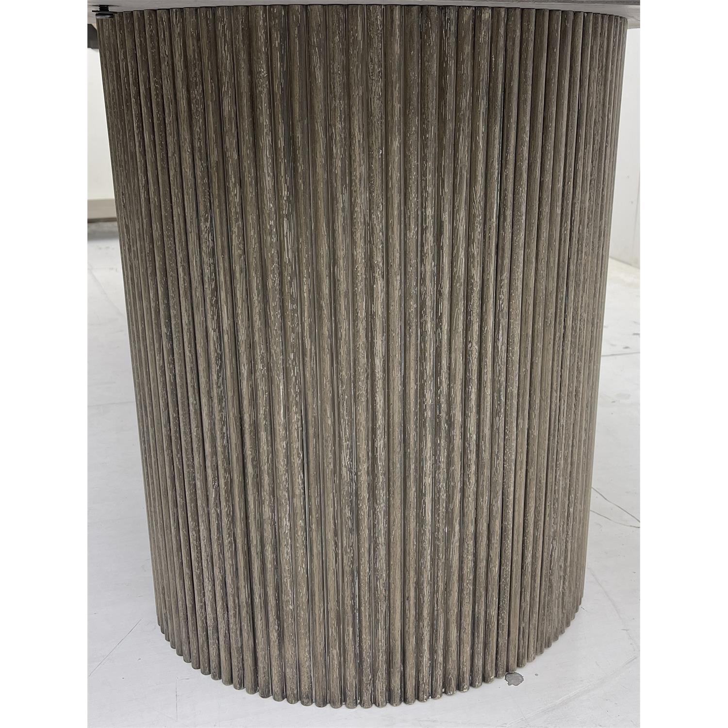 Close-up of the vertical reeded pedestal on the Sienna dining table