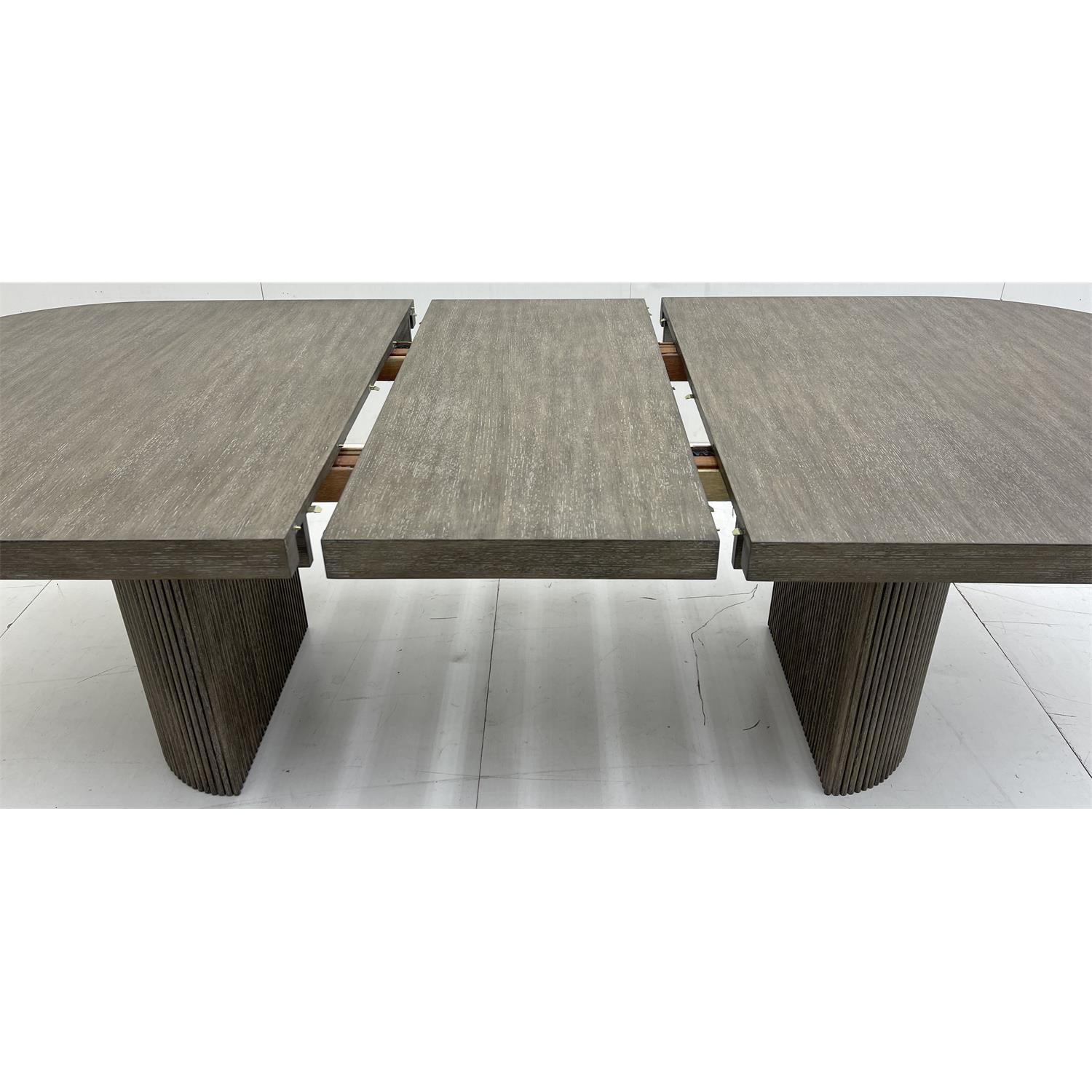 Sienna dining table with 20 inch leaf being inserted