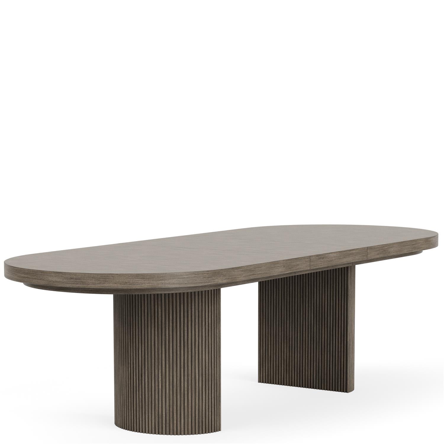 Sienna extendable dining table with reeded double pedestal base, angled view