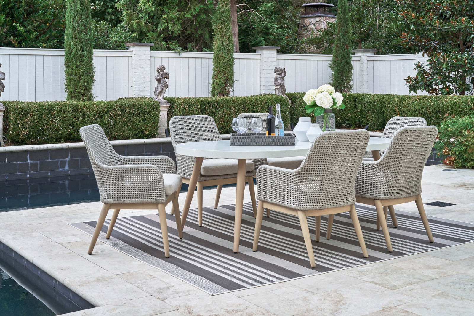 St Barts Open Weave 7-Piece Outdoor Dining Set with oval table and 6 fixed arm chairs