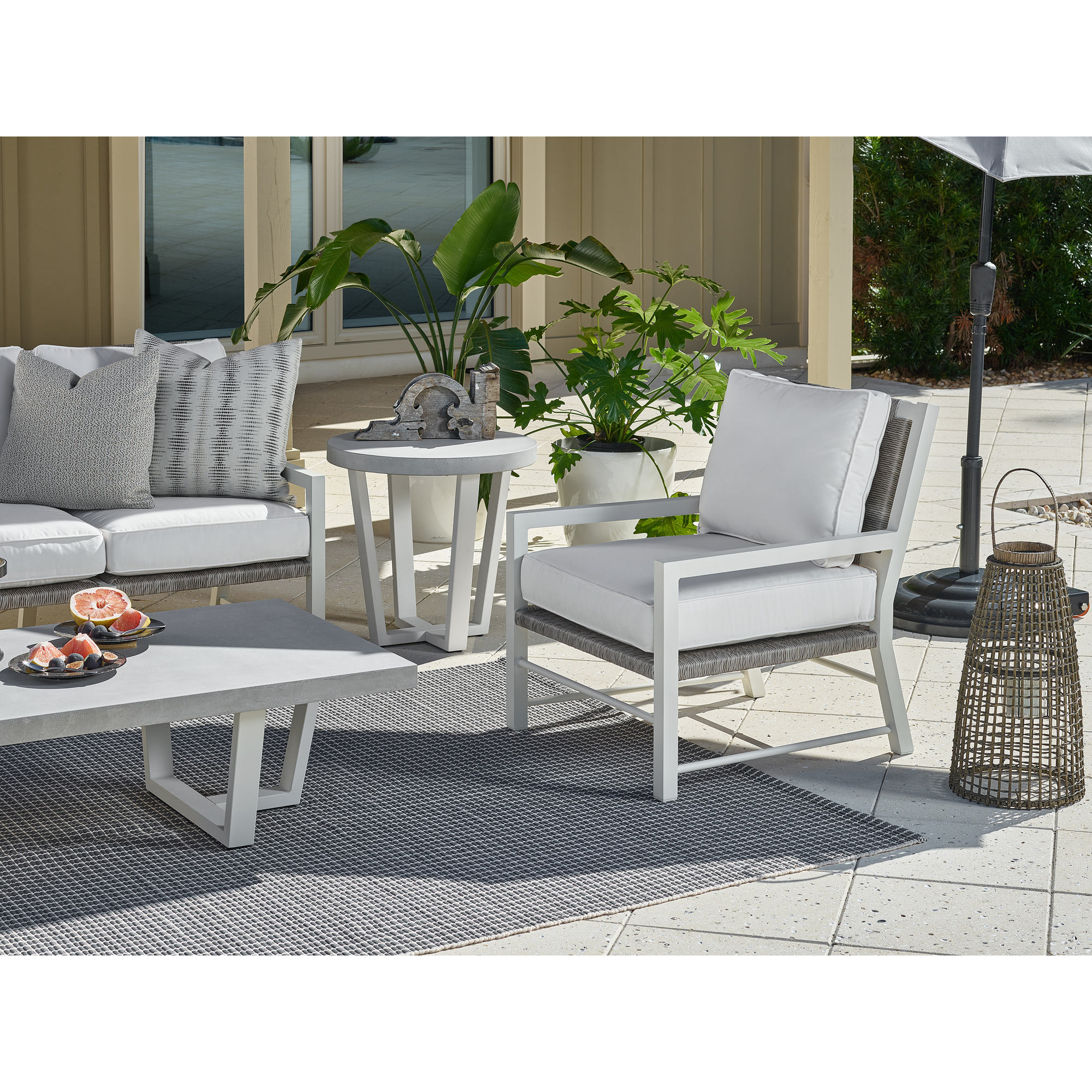South Beach outdoor club chair with Sunbrella cushions — two included in the 7-piece Lux Seating Set