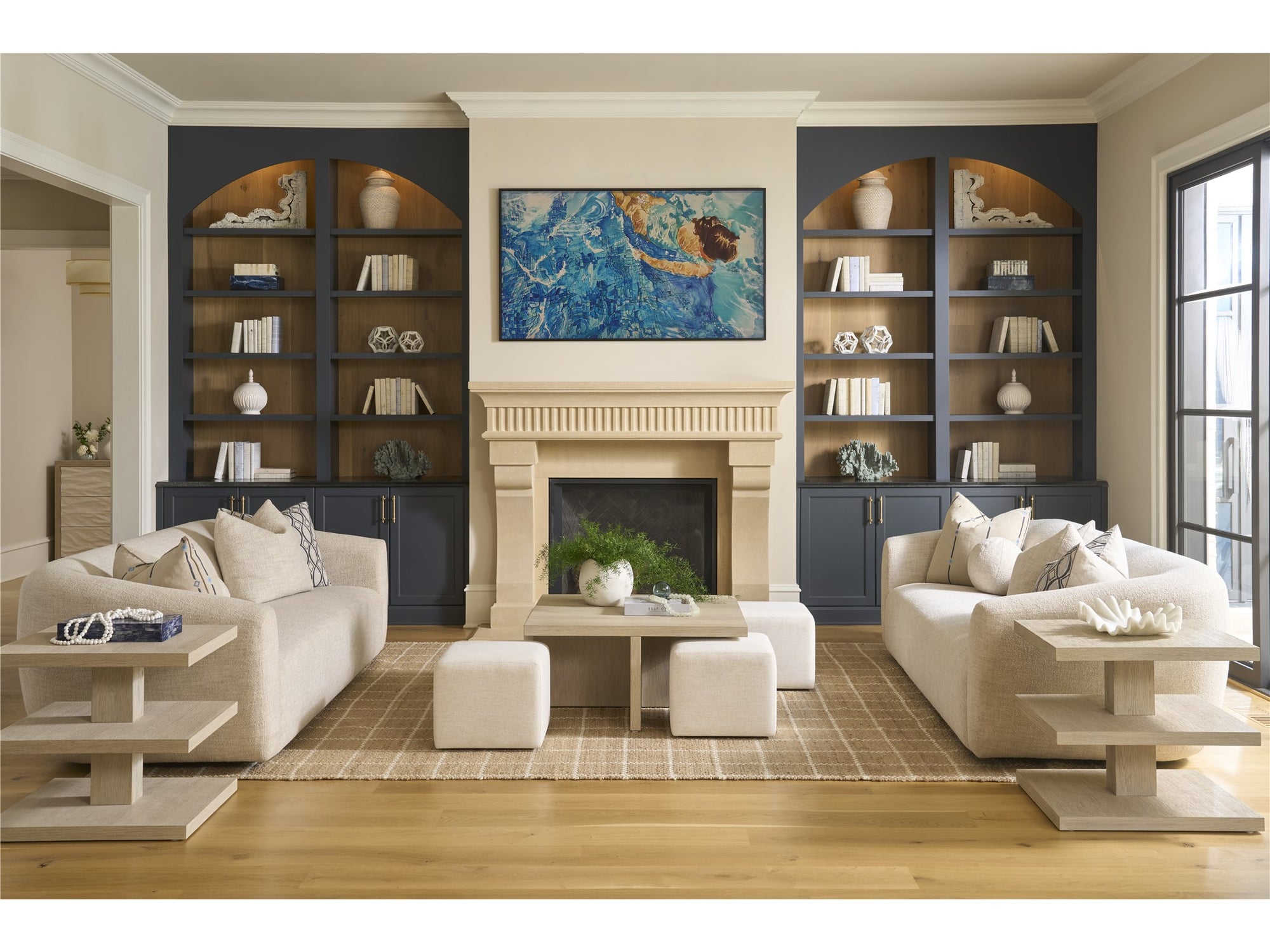 Universal Renya 101" curved sofa in Yukon Sand, shown as a facing pair in a fireplace living room