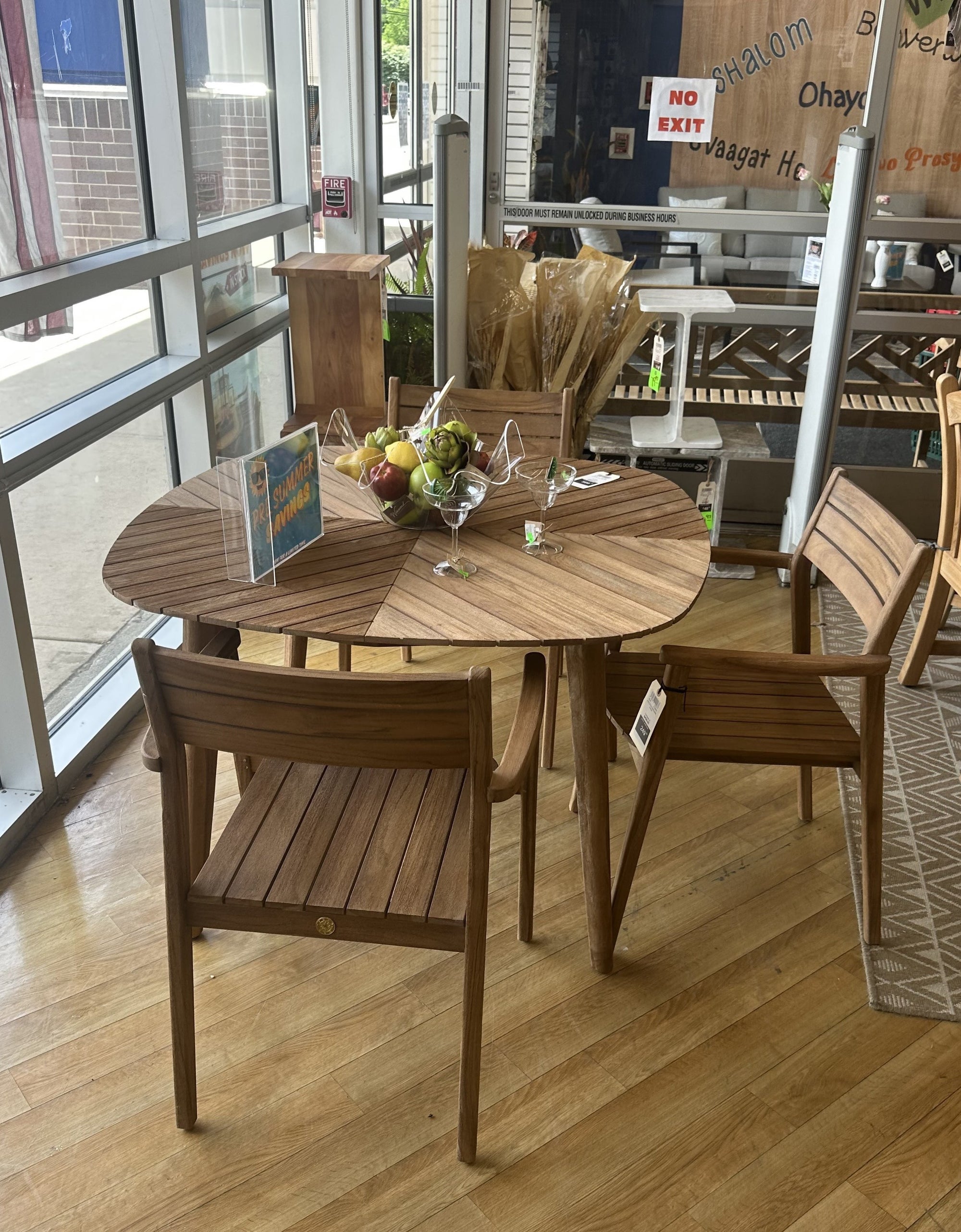 Jade teak square dining table with stacking arm chairs