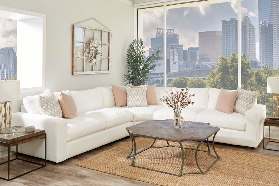 Oversized white custom sectional in a city apartment with floor-to-ceiling windows
