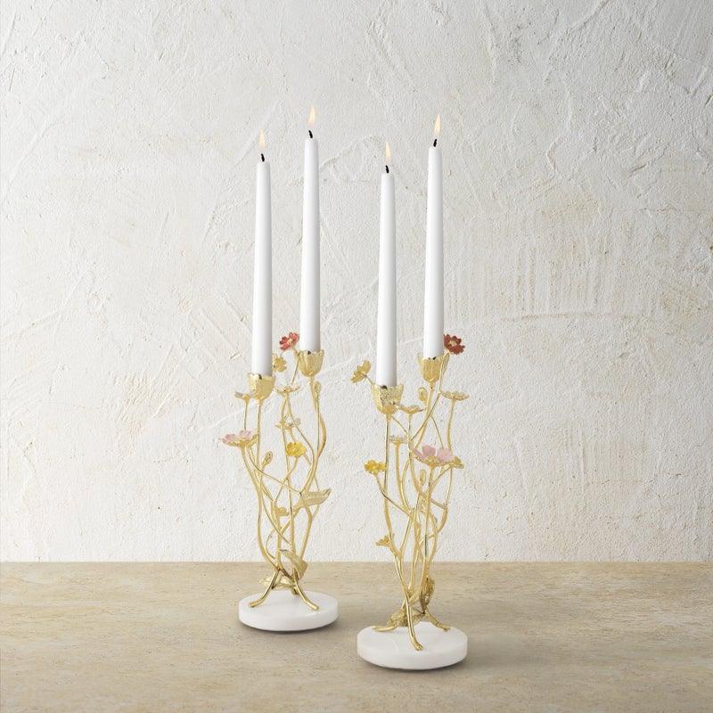 Michael Aram Wildflowers candleholders with lit tapers