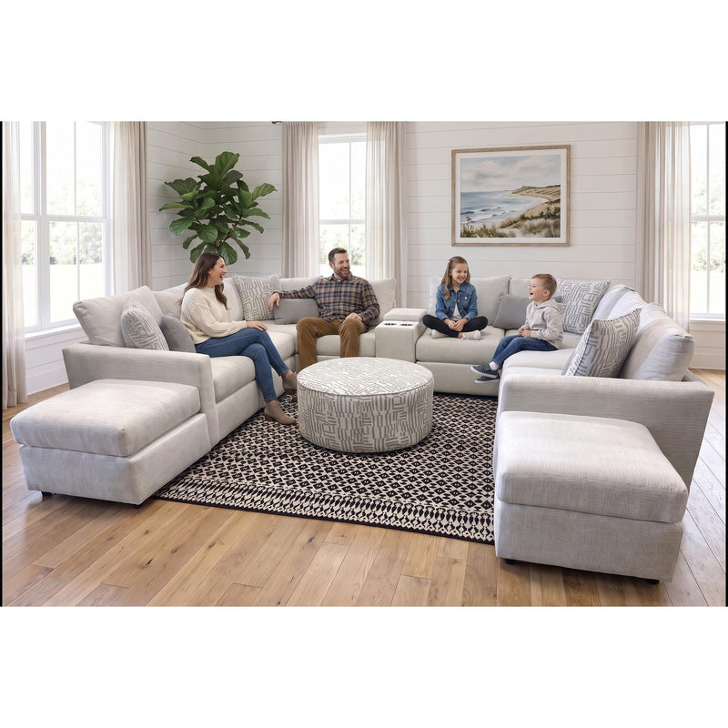 A family relaxing on the Build Your Own Sectional, the U configuration from our store floor, in a bright living room