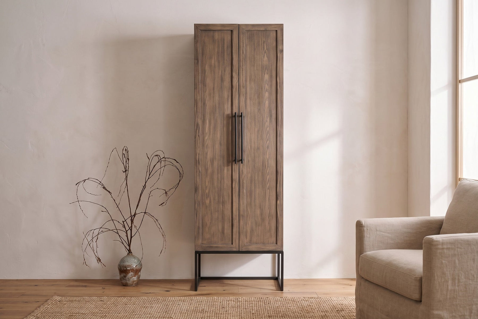 Dwell Latte 85-inch utility cabinet with solid wood doors in a living room
