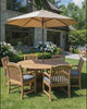 Video: the Komodo round teak dining set under an umbrella