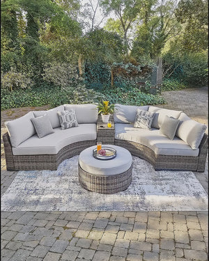 Video: the Montauk Curve sectional on a stone patio — view 2