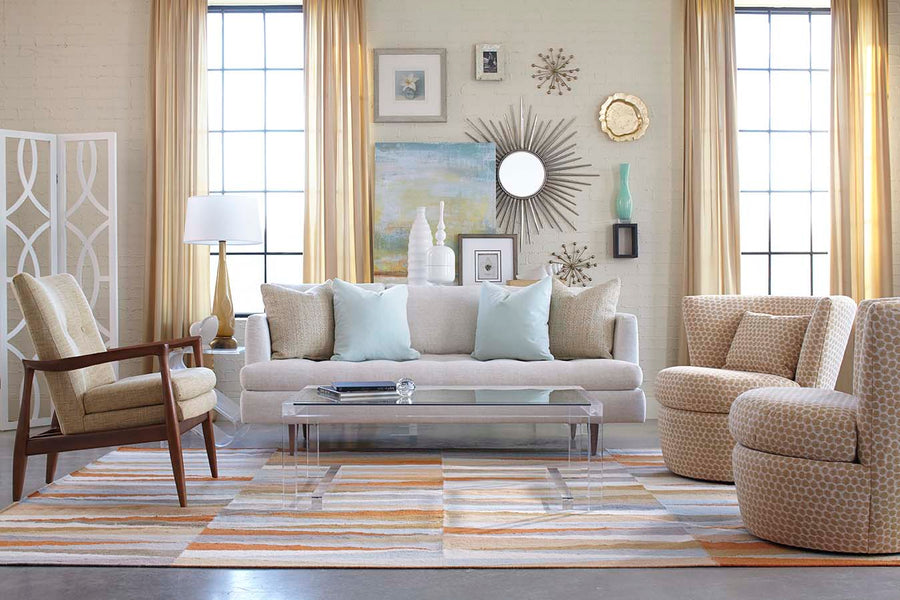 Custom sofa with coordinated swivel chairs in a bright living room